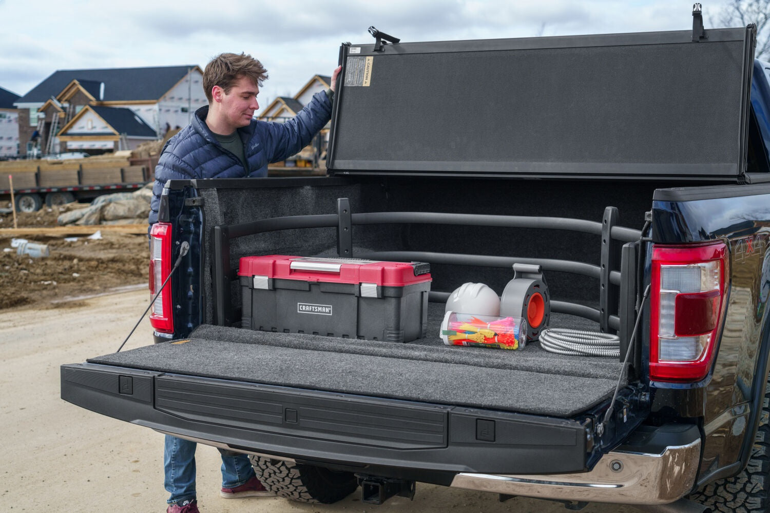 https://www.catalograck.com/ImgVDHR/AMP/AMPamp-bedxtender-sport-2020-ford-f150-blue-construction-lifestyle-00.jpg