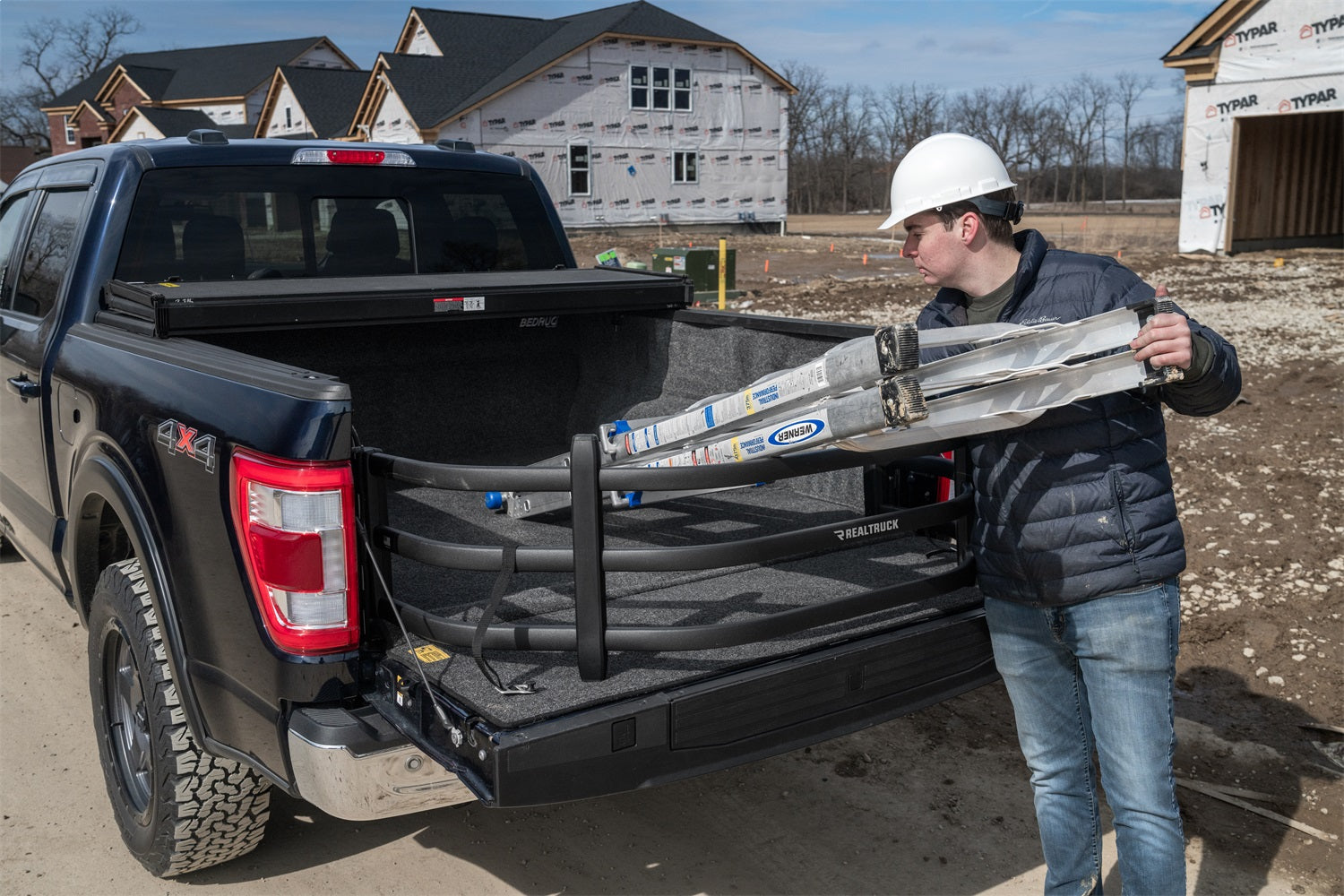 https://www.catalograck.com/ImgVDHR/AMP/amp-bedxtender-sport-2020-ford-f150-blue-construction-lifestyle-03.jpg
